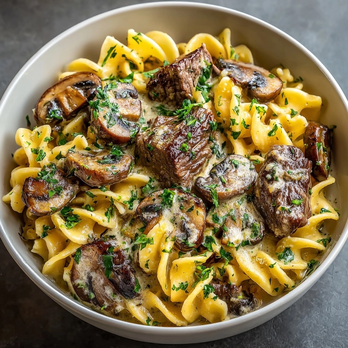 Creamy Slow Cooker Beef Stroganoff simmering, rich aroma fills the kitchen, ready to serve.