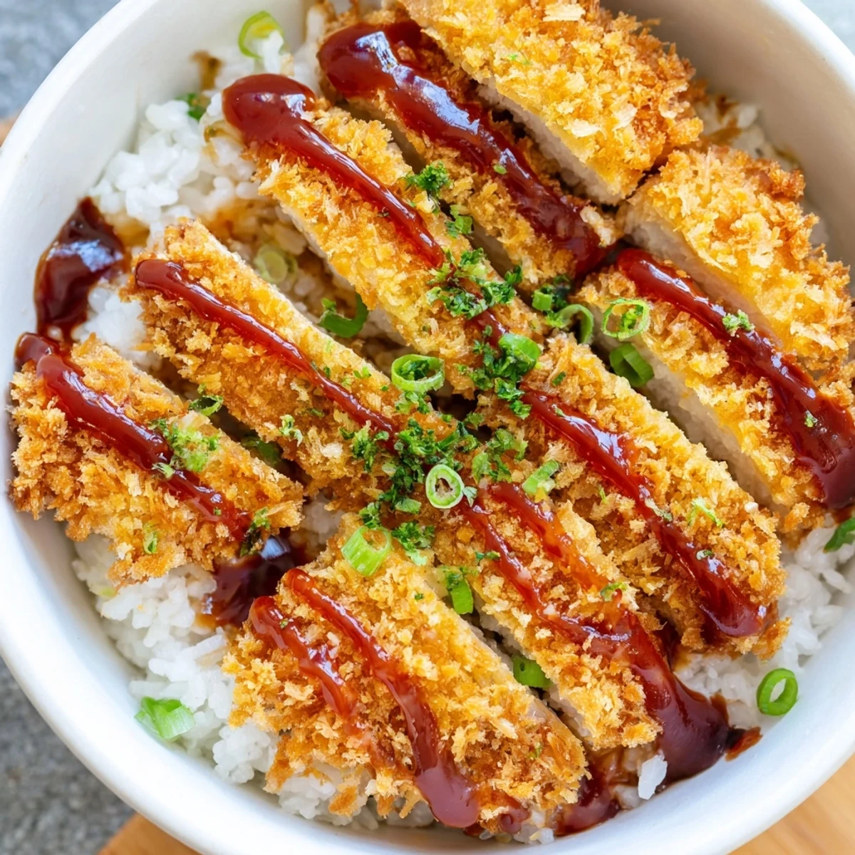 Crispy Japanese Katsu Bowls with Tonkatsu Sauce, served over fluffy sushi rice.  