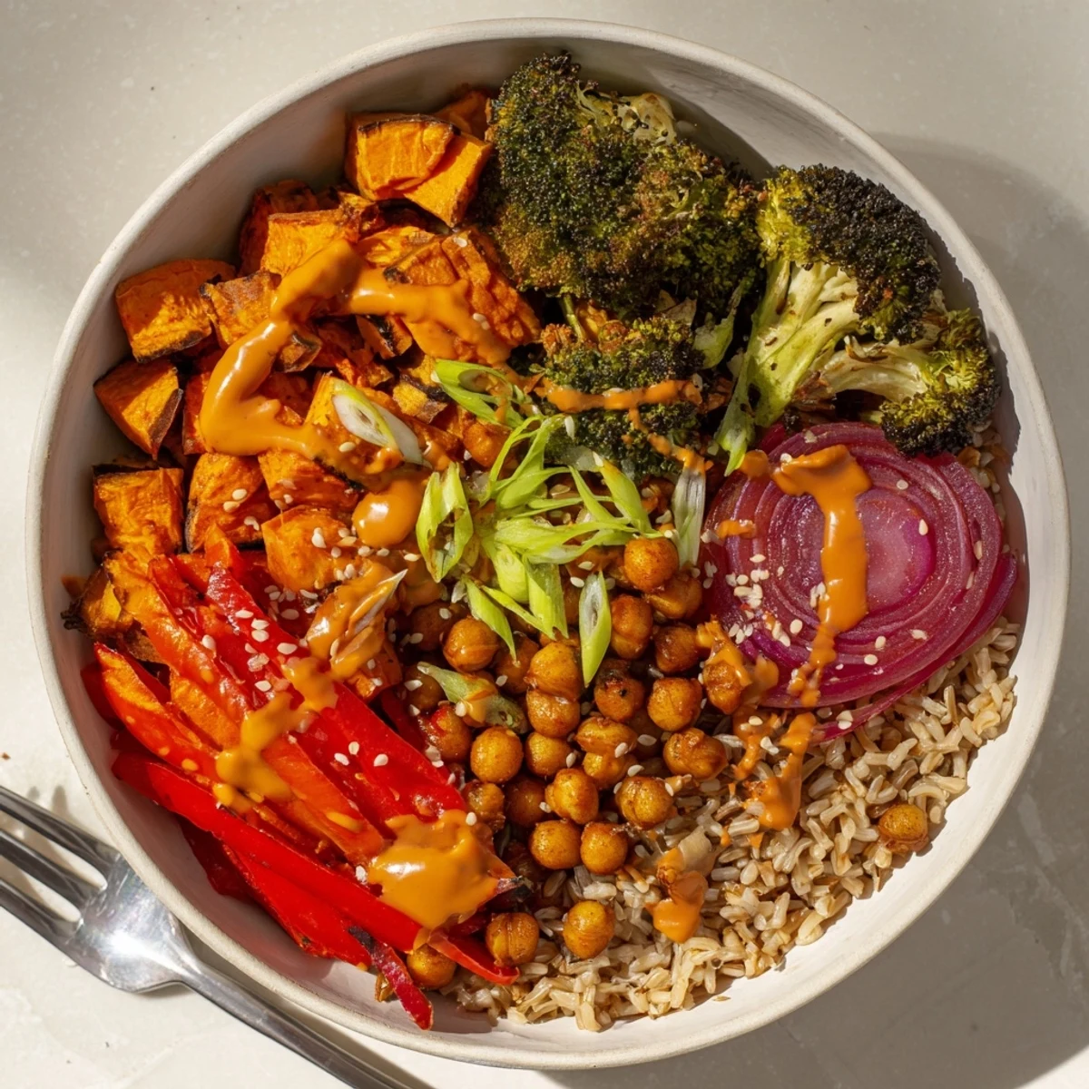 Vibrant Bold Sauce Drizzle Bowls topped with fresh vegetables and richly spiced sauces.  