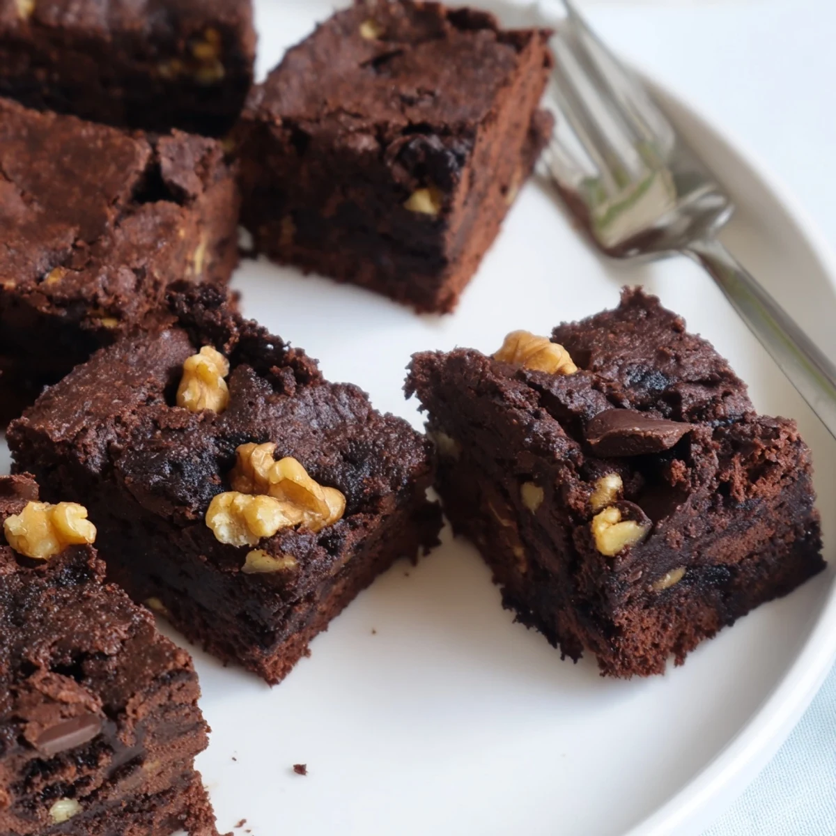 Fudgy brownies made with nut-milk pulp, offering rich chocolate flavor and minimal waste.  