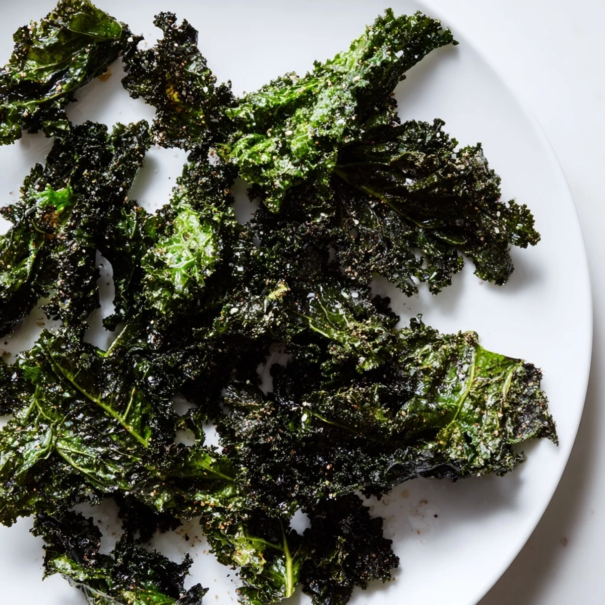 Golden, crispy baked kale chips, a healthy snack, ready for that satisfying crunch.
