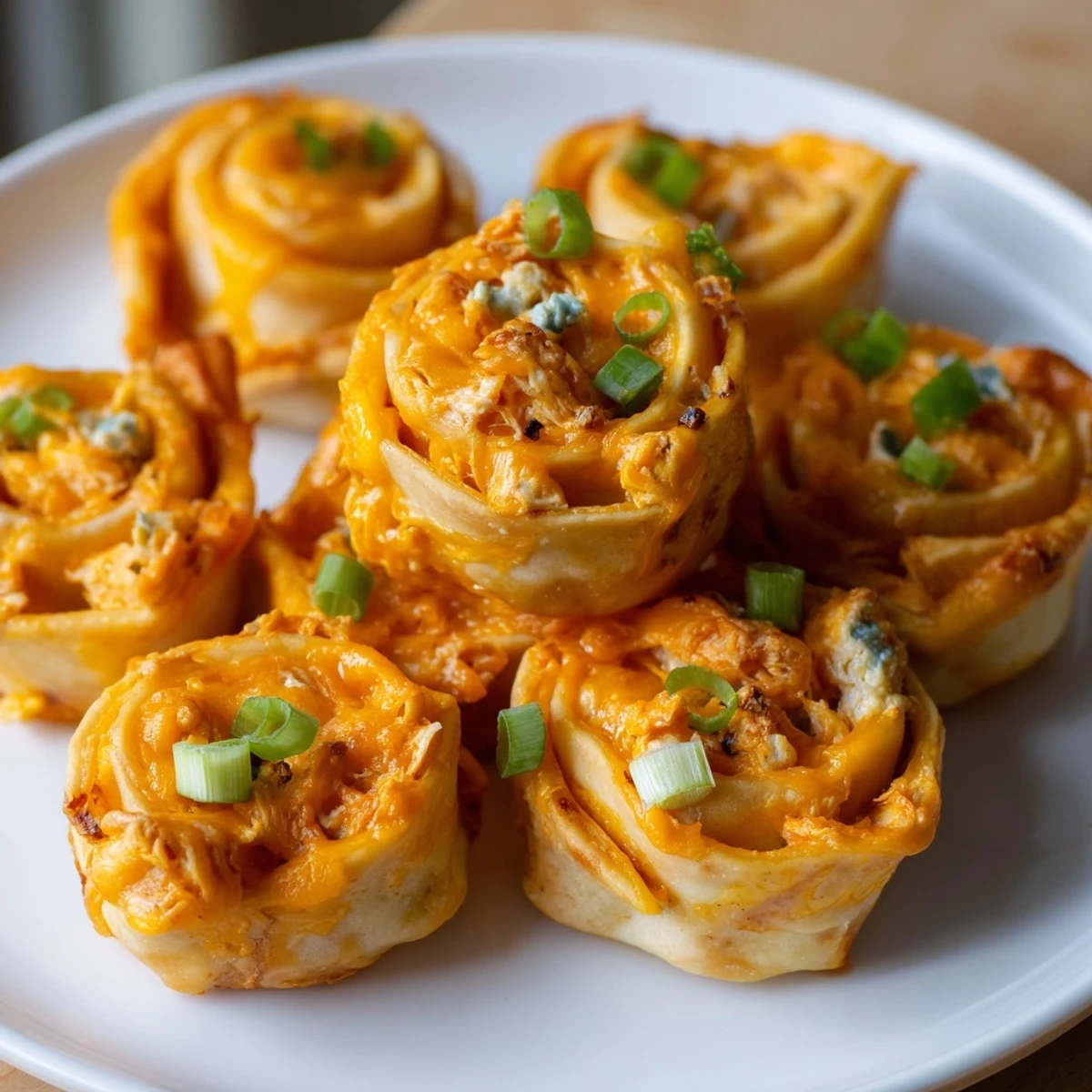 Freshly baked Buffalo Chicken Dip Pinwheel Wontons, showcasing a creamy, spicy filling with a crispy edge.