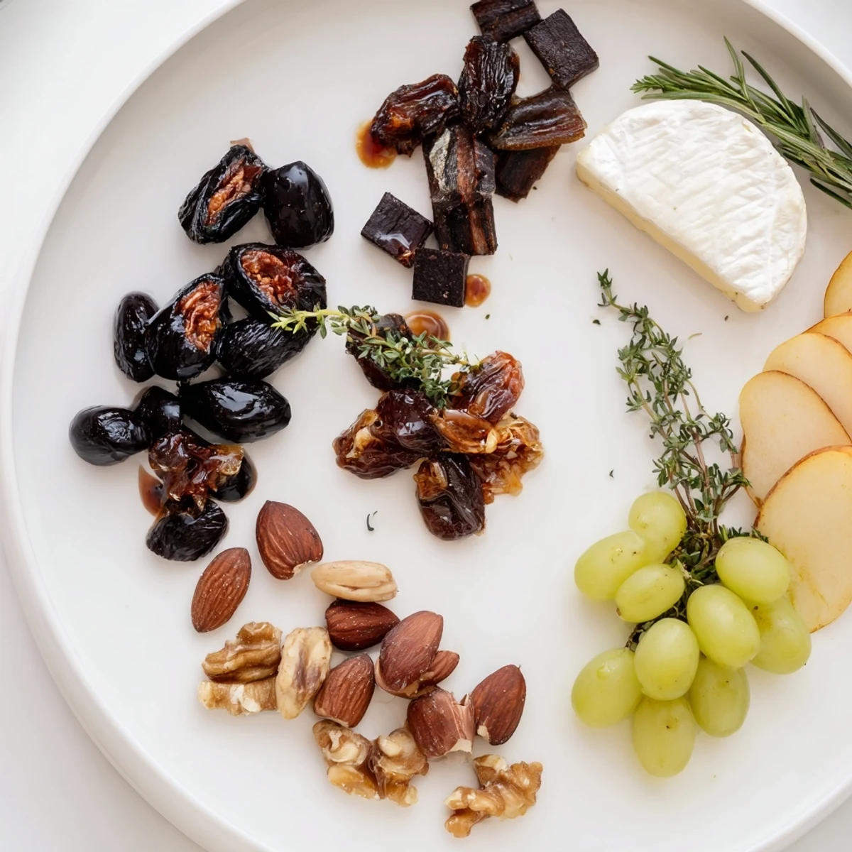 A Winter Solstice Board overflowing with olives, figs, and Brie; perfect for entertaining.
