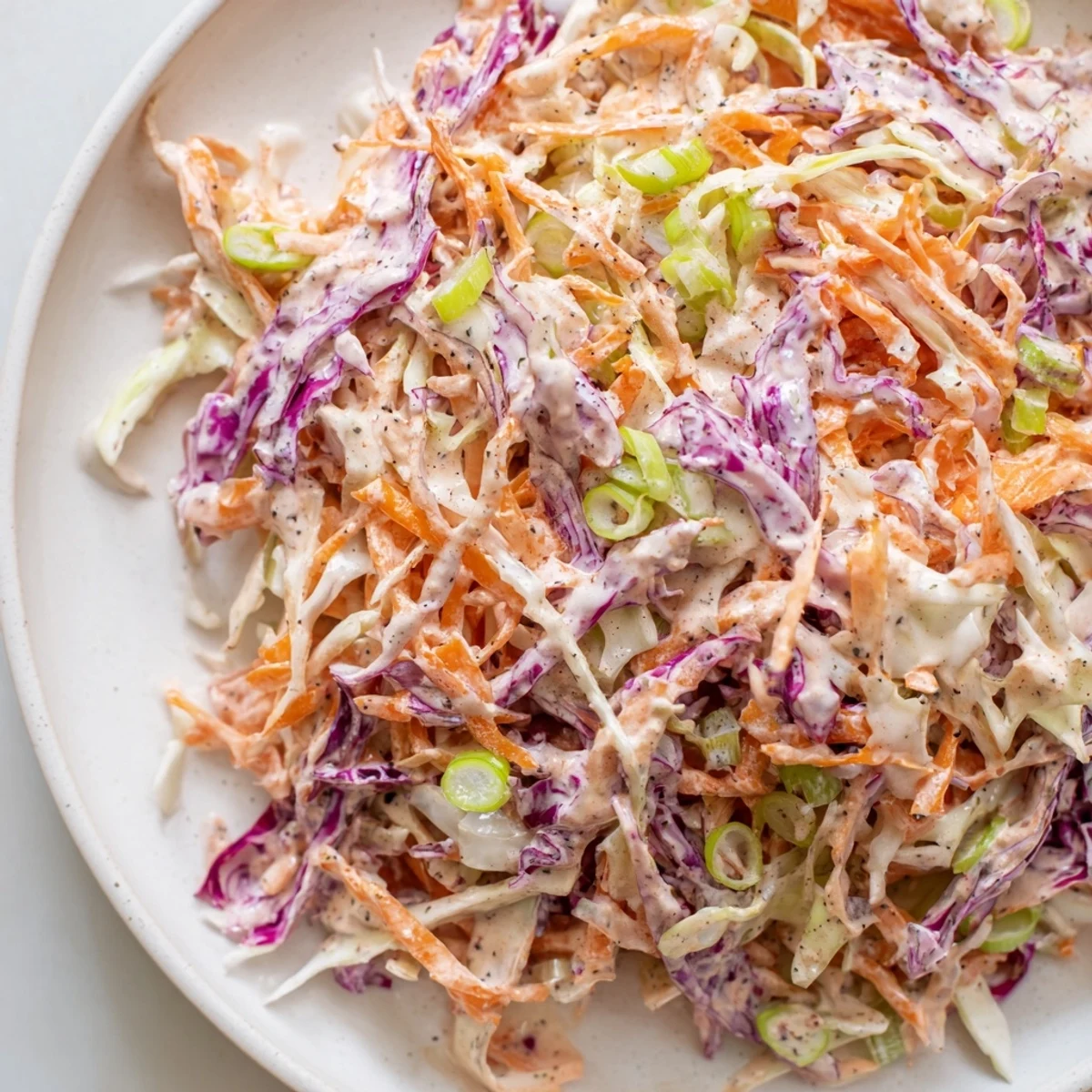 Vibrant Quick Coleslaw Salad filled with shredded cabbage and carrots, coated in creamy dressing.