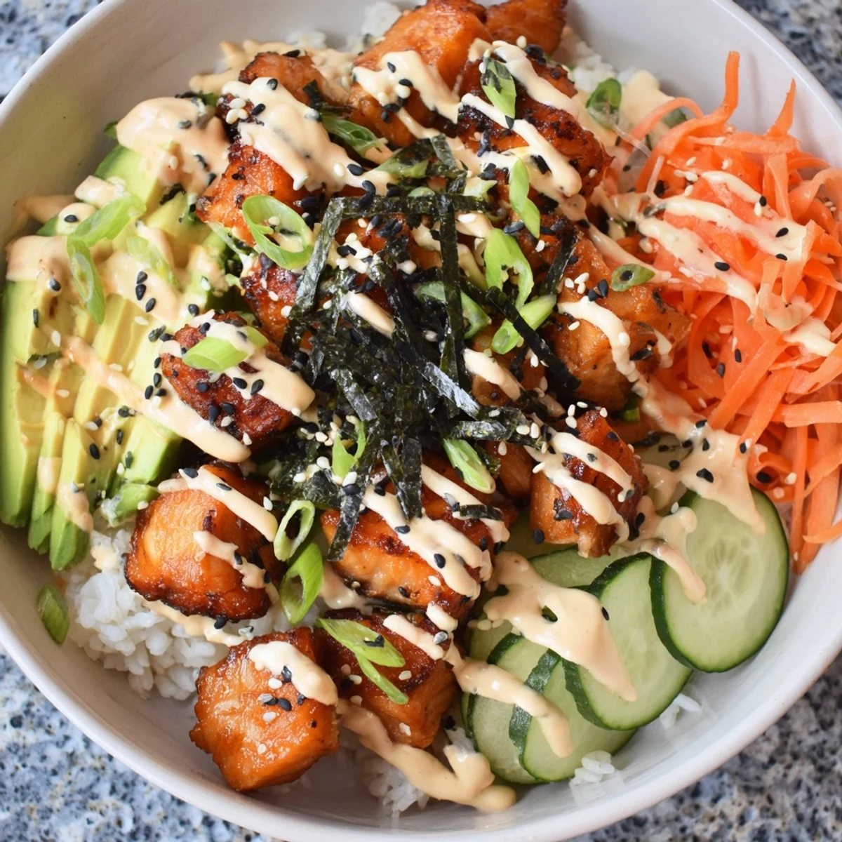 Crispy salmon bites bowl: a delicious, colorful meal featuring flaky salmon and fresh veggies, ready to enjoy.