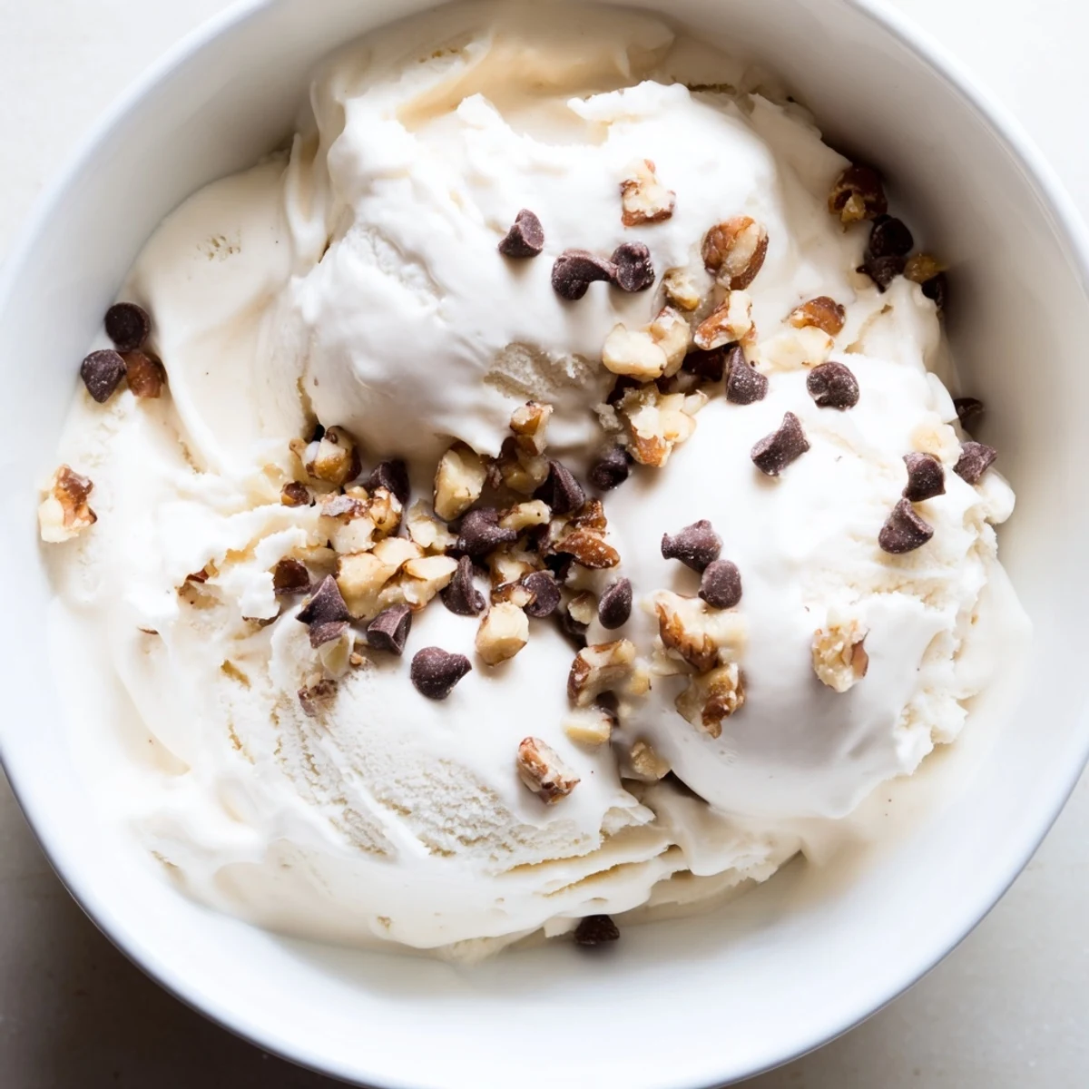 A close-up of homemade cottage cheese ice cream, full of rich vanilla flavor and texture.