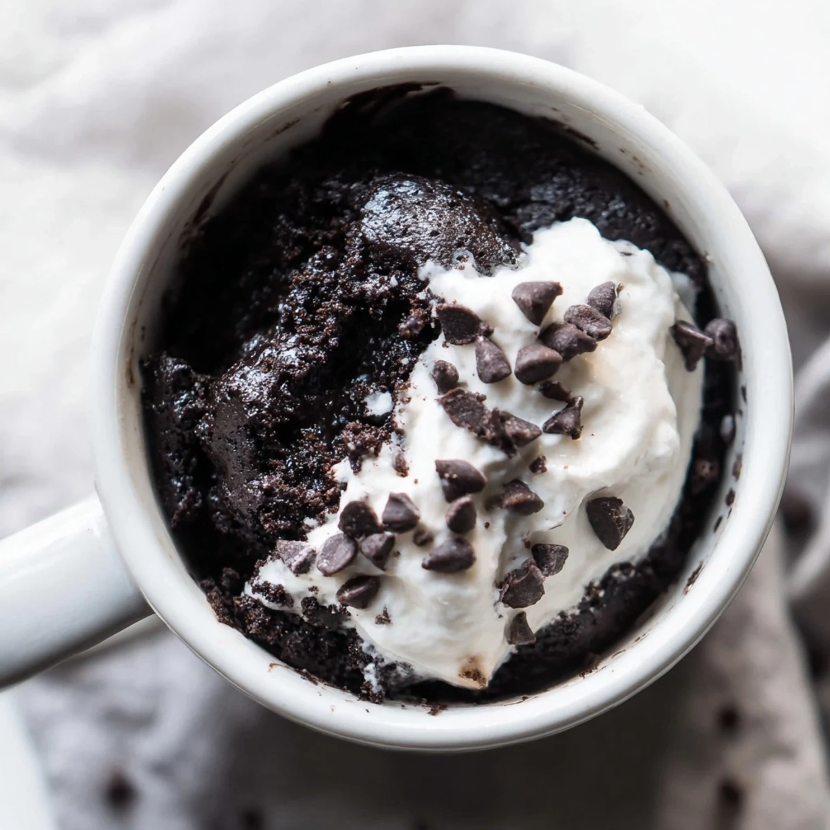Warm and delicious Oreo mug cake, a quick chocolate dessert with fluffy, moist texture.