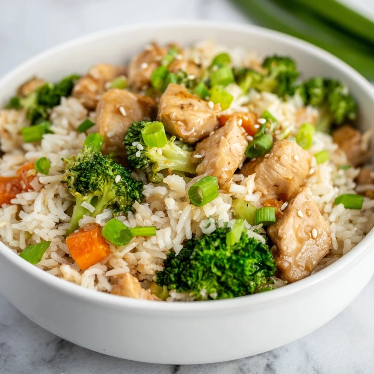 The golden chicken and crisp broccoli combine with fluffy rice in this One Pan Honey Garlic Chicken Broccoli Rice dinner.