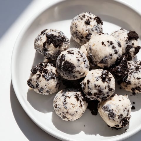 Close-up of Cream Cheese Oreo Protein Balls, showing creamy texture and crunchy Oreo bits.