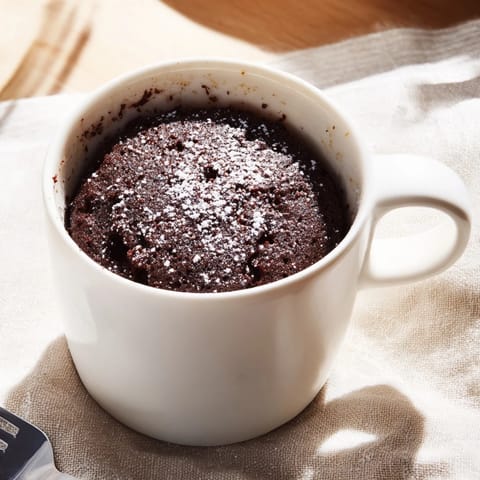 A single-serving, rich chocolate Microwave Mug Cake, perfectly cooked in the microwave.