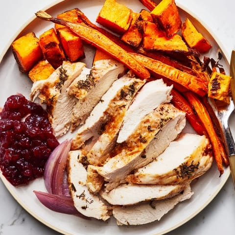 This delicious image shows juicy roasted Harvest Turkey Platter slices surrounded by colorful autumn veggies.