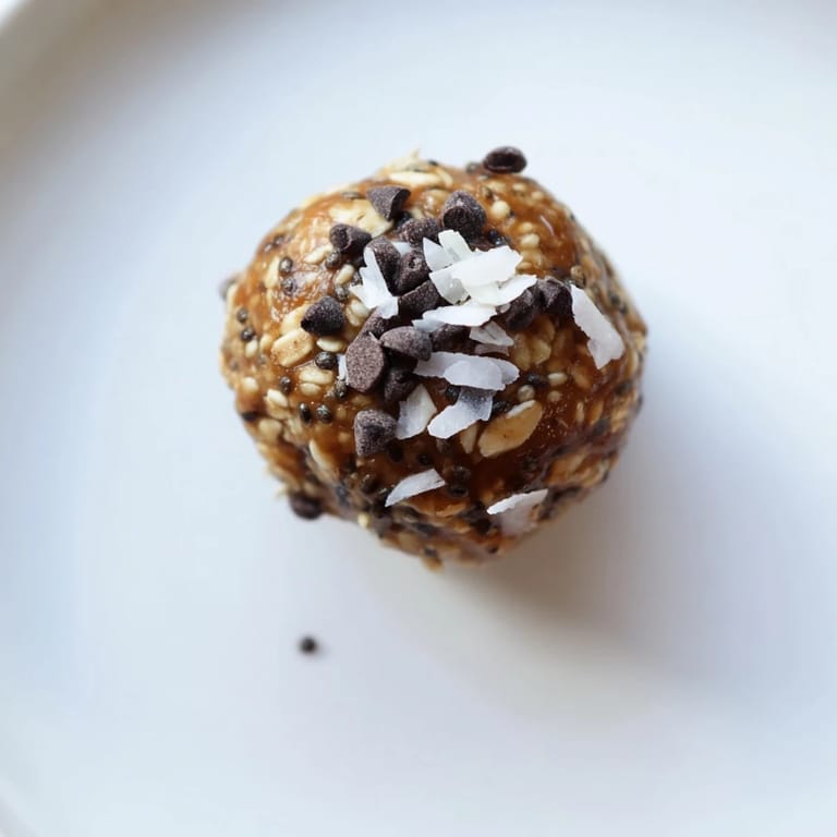 Homemade Almond-Chia Energy Bites, a healthy snack, rolled into small, inviting balls with chocolate chips.