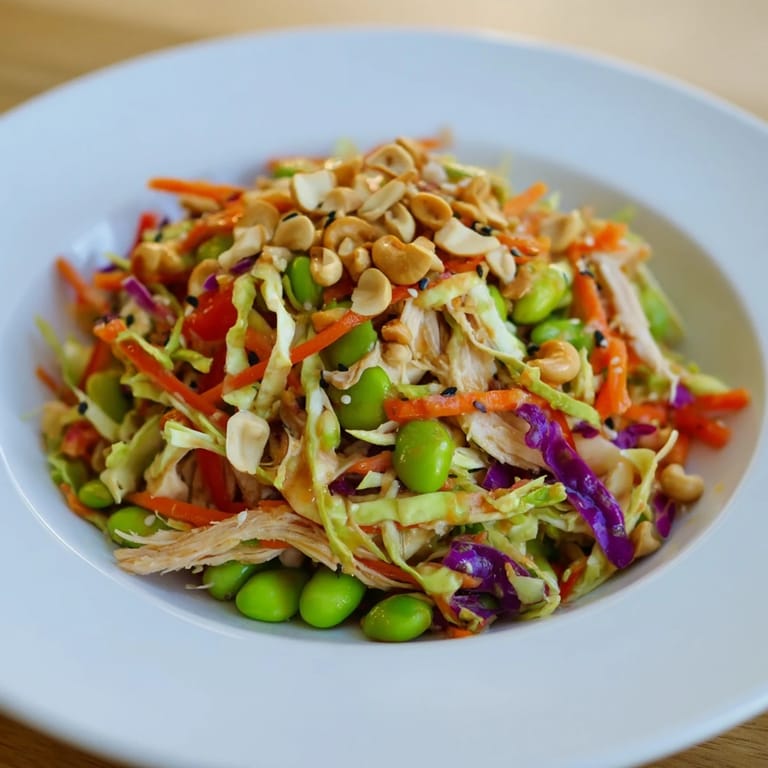Edamame Crunch Chicken Salad features crisp vegetables and tender shredded chicken, topped with crunchy cashews and toasted sesame seeds.  