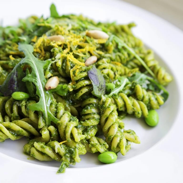 Vibrant vegetarian Spring Green Pesto Pasta Salad served chilled, perfect for a sunny spring picnic or lunch.